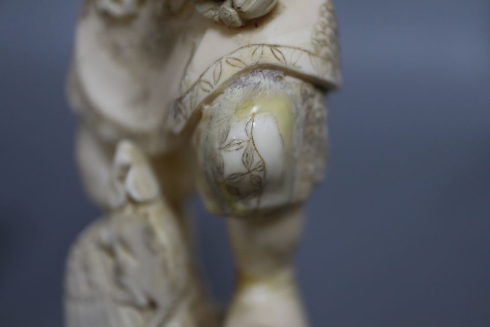 A Japanese ivory okimono of an elder and a dragon, and a marine ivory carving of Daikoku, tallest 25cm